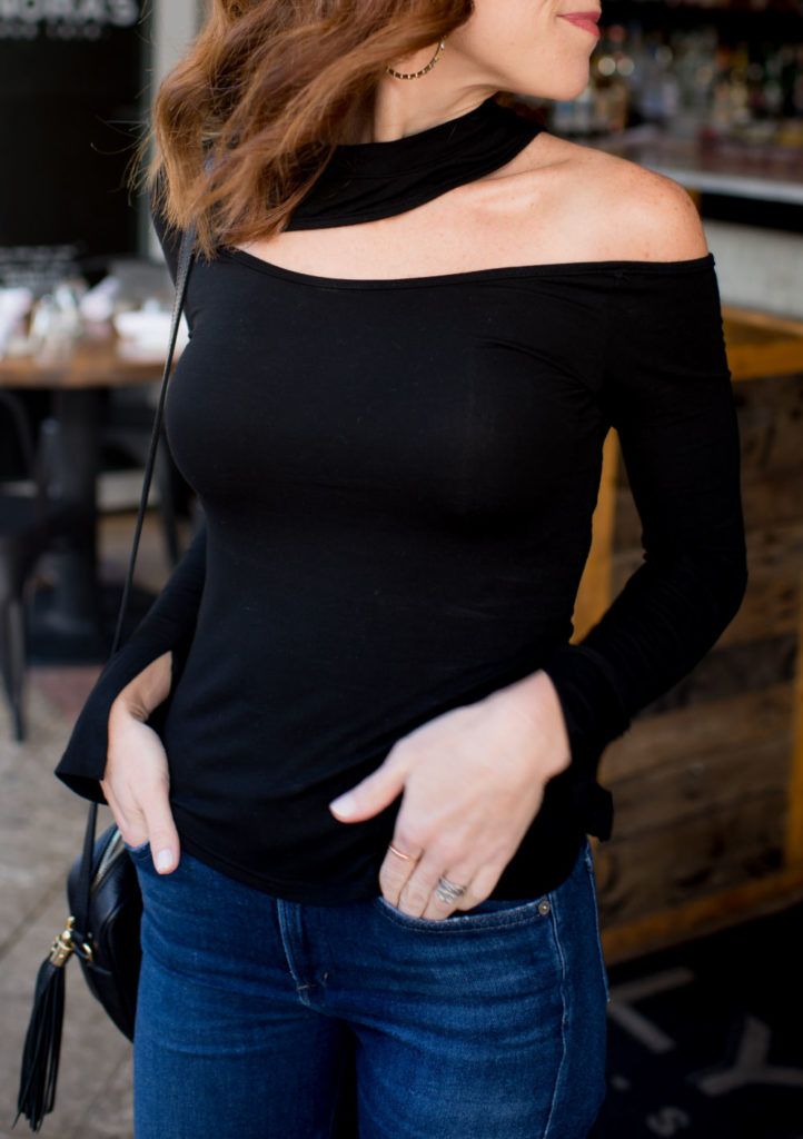 Black Top and Jeans Outfit featured by top US fashion blog The Modern Savvy; Image of a woman wearing an Amazon top, Citizens of Humanity jeans, Kendra Scott earrings, Sam Edelman heels and Gucci purse.