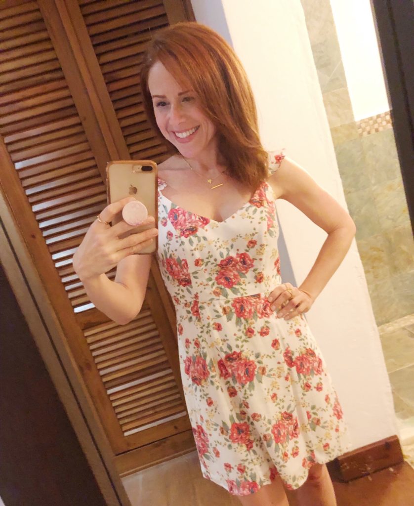 What to Wear in Punta Cana featured by top US fashion blog The Modern Savvy; Image of a woman wearing a Floral dress