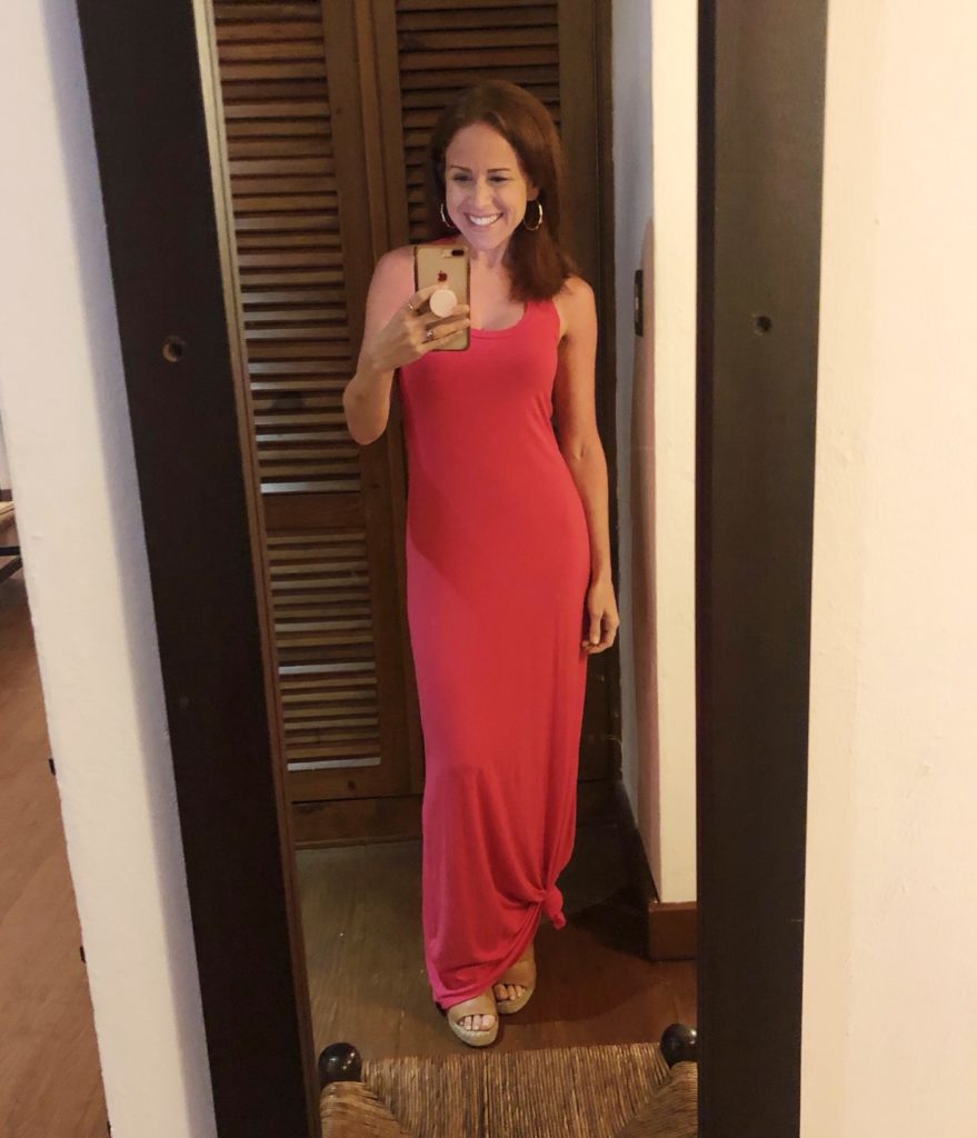 What to Wear in Punta Cana featured by top US fashion blog The Modern Savvy; Image of a woman wearing a pink Amazon maxi dress.