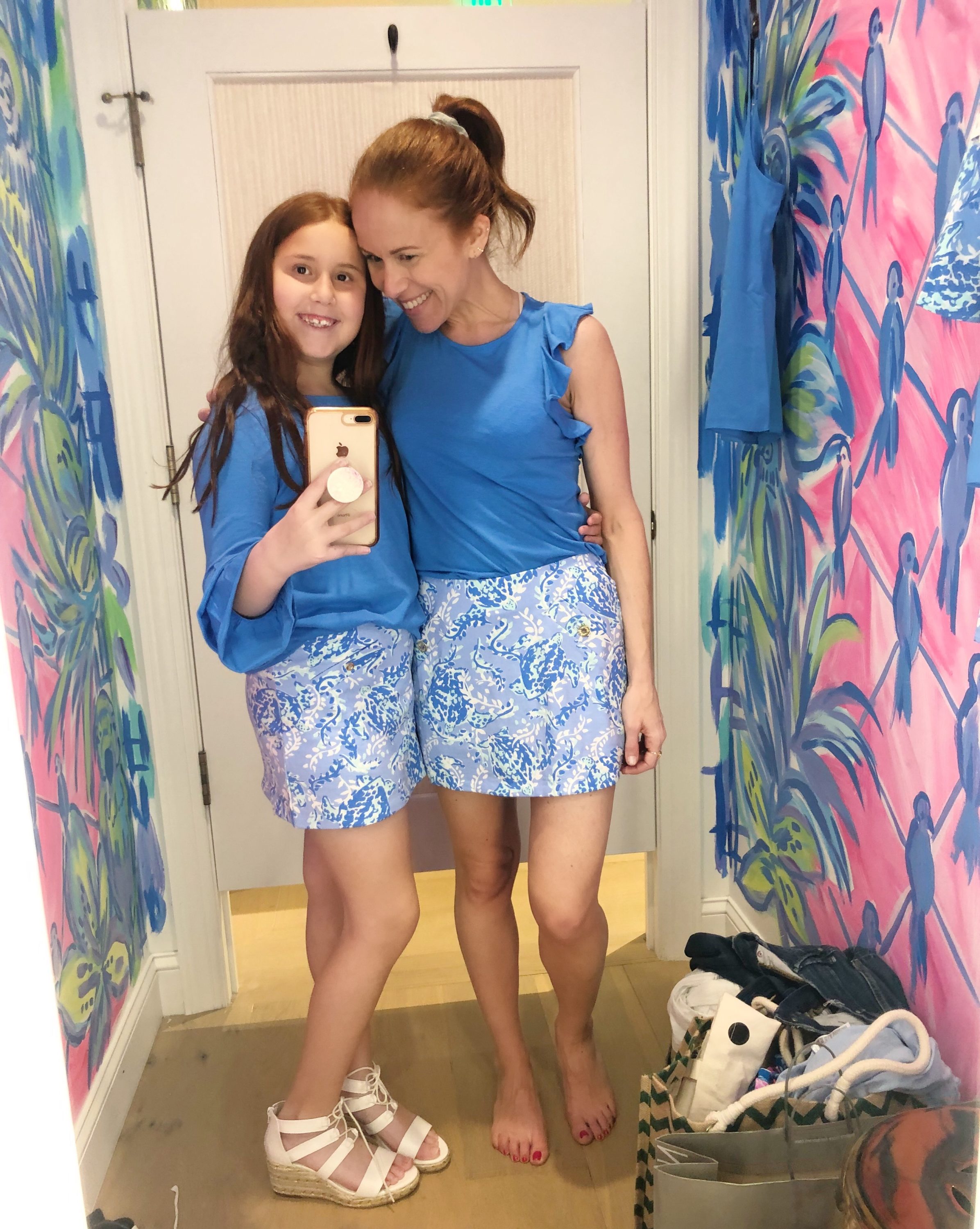 What to Get at the Lilly Pulitzer After Party Sale by popular Florida fashion blog, The Modern Savvy: image of a woman and her daughter wearing a Lilly Pulitzer GIRLS MAZIE TOP, Lilly Pulitzer GIRLS MINI MADISON SKORT, Lilly Pulitzer LANETTE TOP, and Lilly Pulitzer MADISON SKORT.