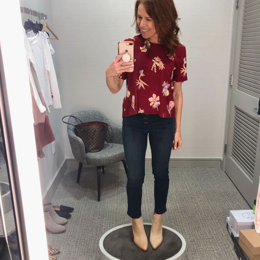 Nordstrom Anniversary Sale 2019: Fitting Room Try-On Session & My Favorite Under $100 finds! by popular Florida fashion blog, The Modern Savvy: image of woman inside a Nordstrom dressing room wearing a MADEWELL floral top, VINCE CAMUTO BOOTIES and Madewell 10-Inch High Waist Skinny Jeans: Button Front Edition.