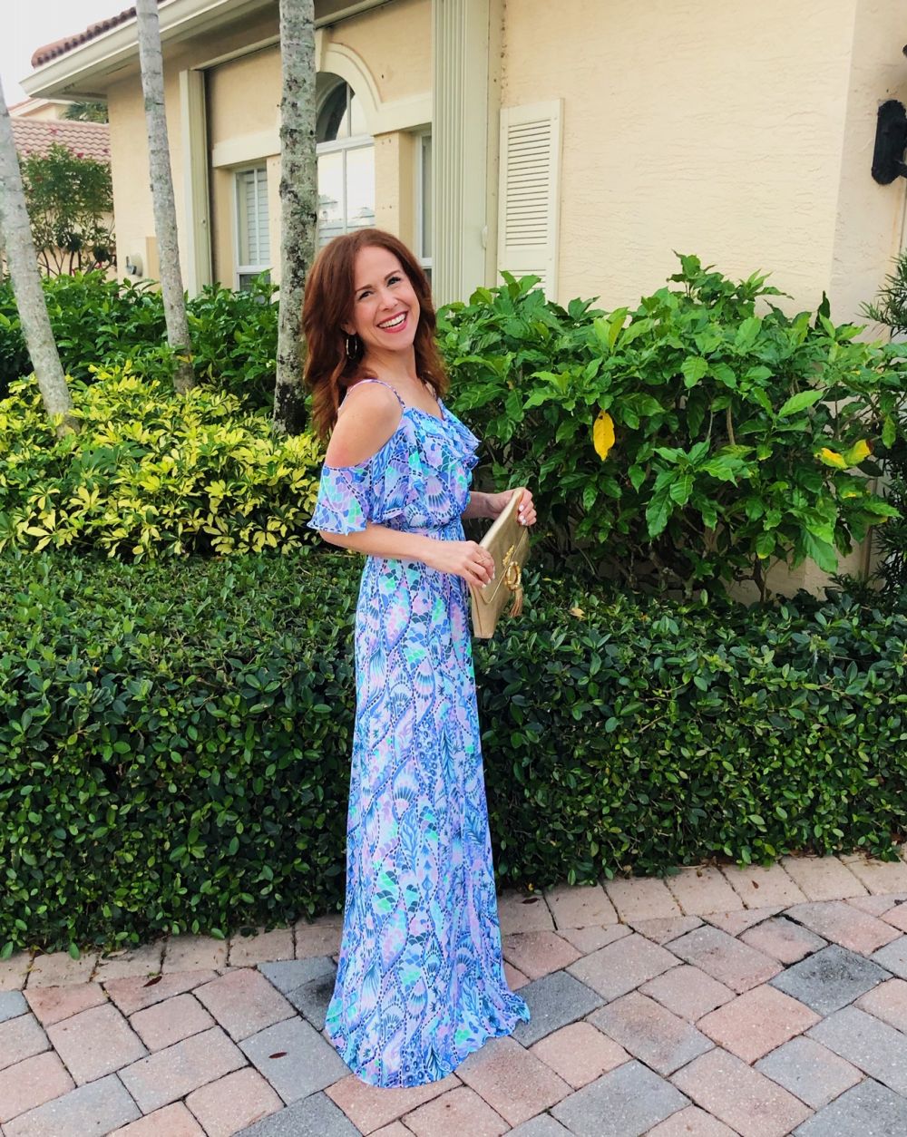 What to Get at the Lilly Pulitzer After Party Sale by popular Florida fashion blog, The Modern Savvy: image of a woman wearing a Lilly Pulitzer ZADIE OFF THE SHOULDER MAXI DRESS. 