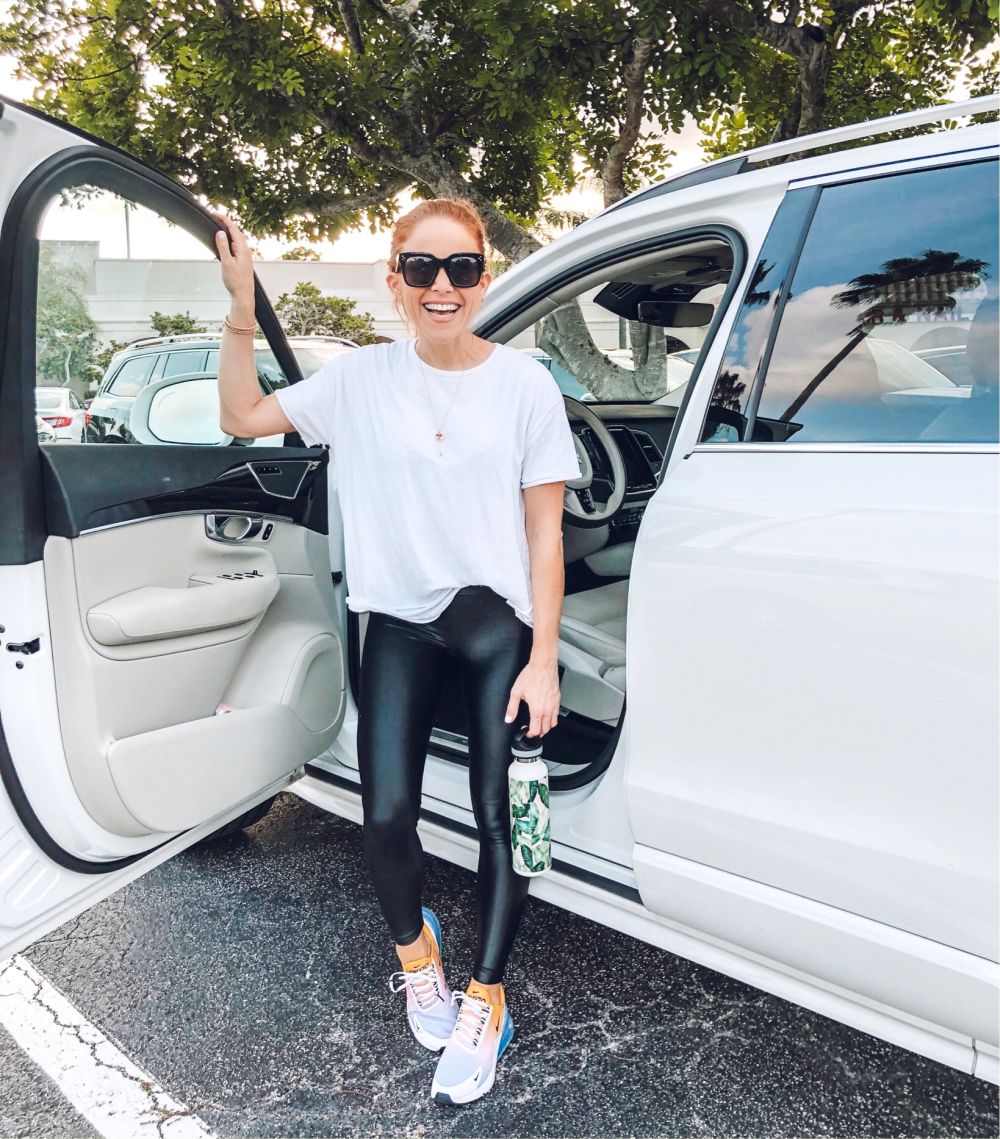Alyson's Current Favorites // September 2019 by popular Florida life and style blog, The Modern Savvy: image of a woman standing next to her car and wearing Koral ultra shiny leggings.