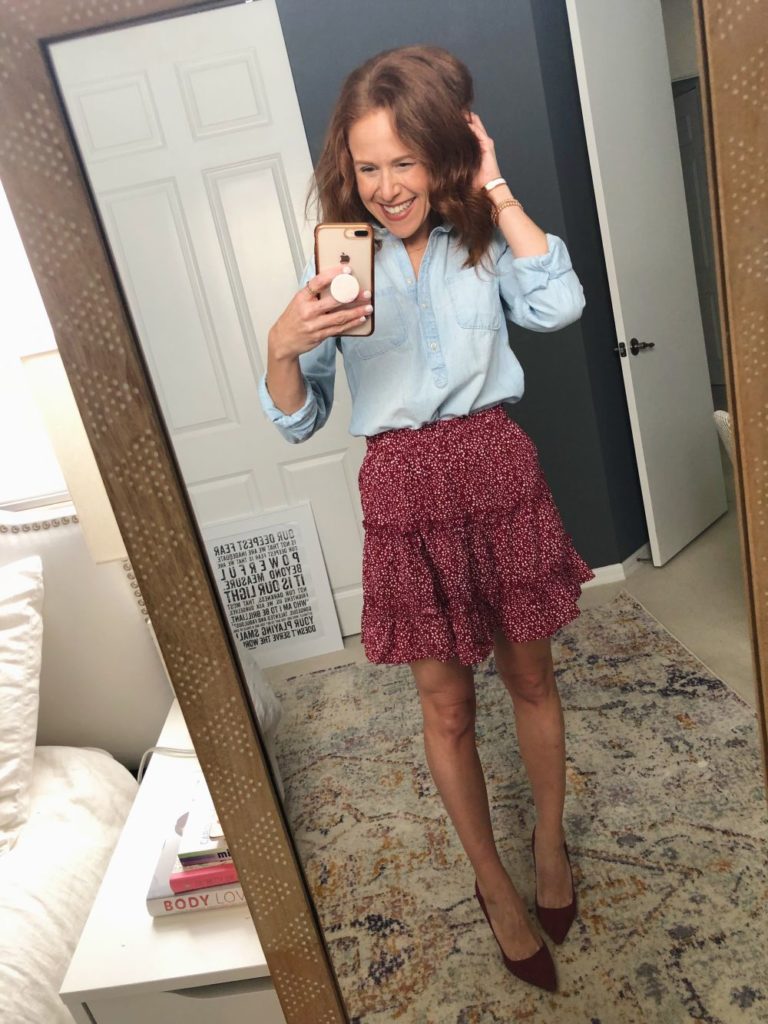 Five Ways to Wear for Fall: The Cutest Under $20 Amazon Skirt by popular Florida fashion blog, The Modern Savvy: image of a woman wearing a Amazon Salamola Women's Leopard Asymmetrical Ruffles High Waist Printed Cute Casual Mini Skirt, denim pullover, and heels.
