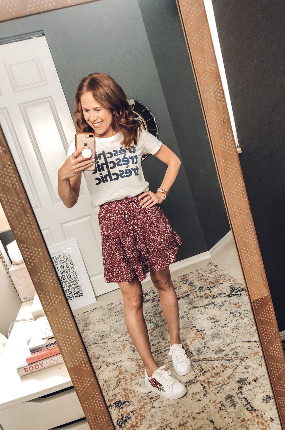 Five Ways to Wear for Fall: The Cutest Under $20 Amazon Skirt by popular Florida fashion blog, The Modern Savvy: image of a woman wearing a Amazon Salamola Women's Leopard Asymmetrical Ruffles High Waist Printed Cute Casual Mini Skirt, J. Crew t-shirt, and sneakers.